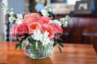 Pink and white flower arrangement in a vase