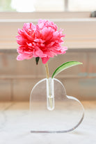 Heart vase with a single pink flower