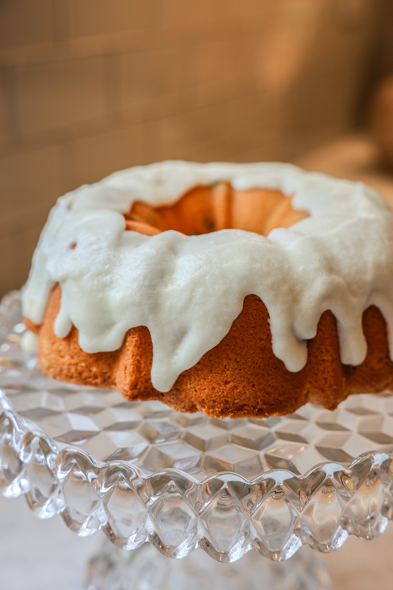 Pound cake with icing on a crystal pedestal