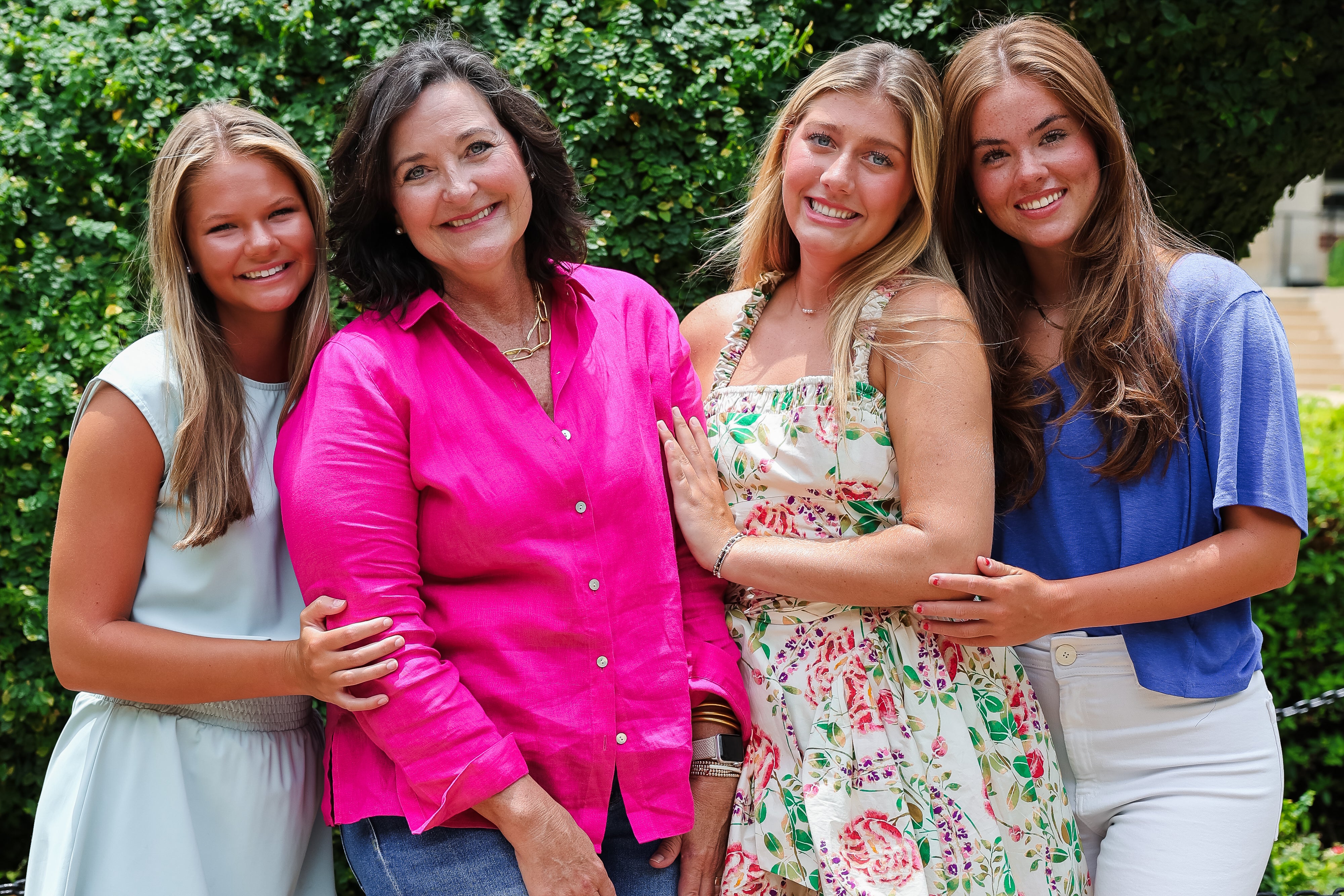 Four girls hugging on the University of Alabama campus