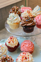 Chocolate, strawberry, vanilla and red velvet cupcakes on a platter