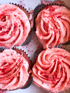 four pink cupcakes