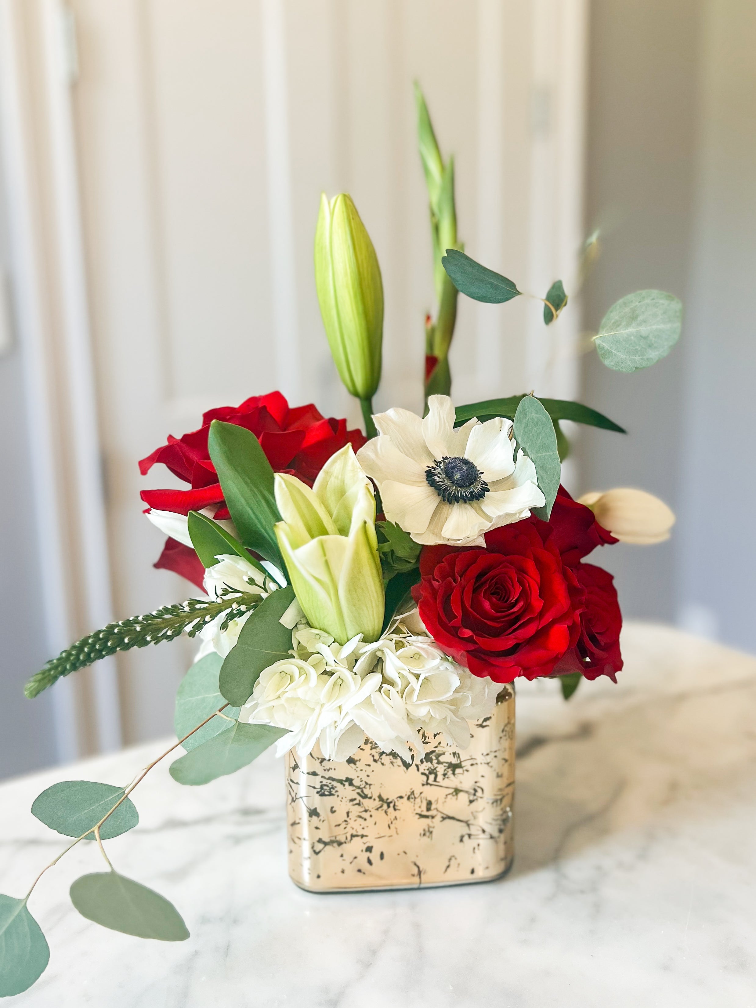 Alabama themed flower arrangement with red and white flowers