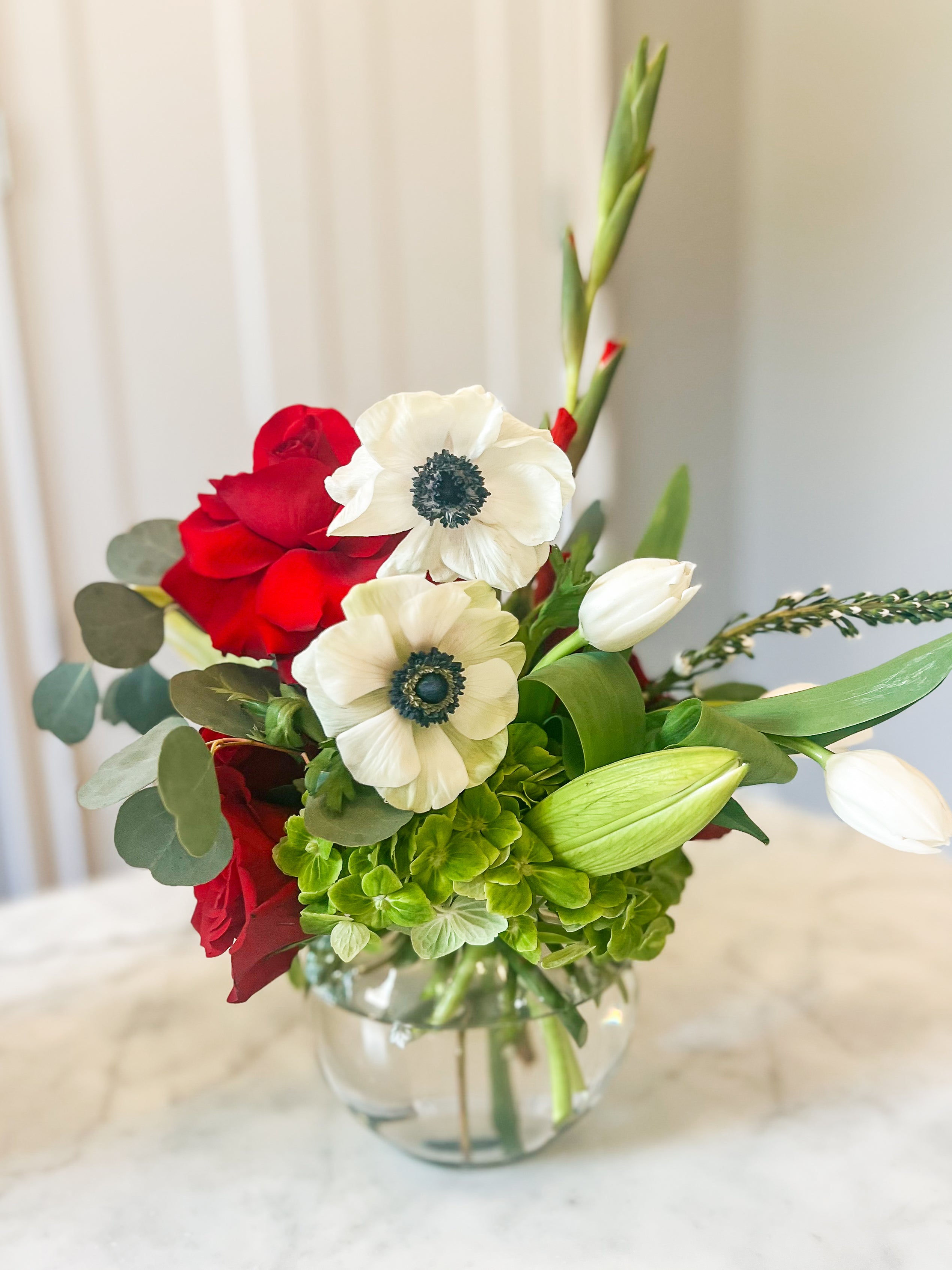 Red and white Alabama themed flower arrangement