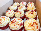 A box of a dozen red velvet cupcakes